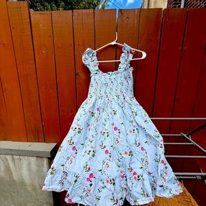 Hill House Elizabeth Mini Nap Dress in blue floral.
Size small